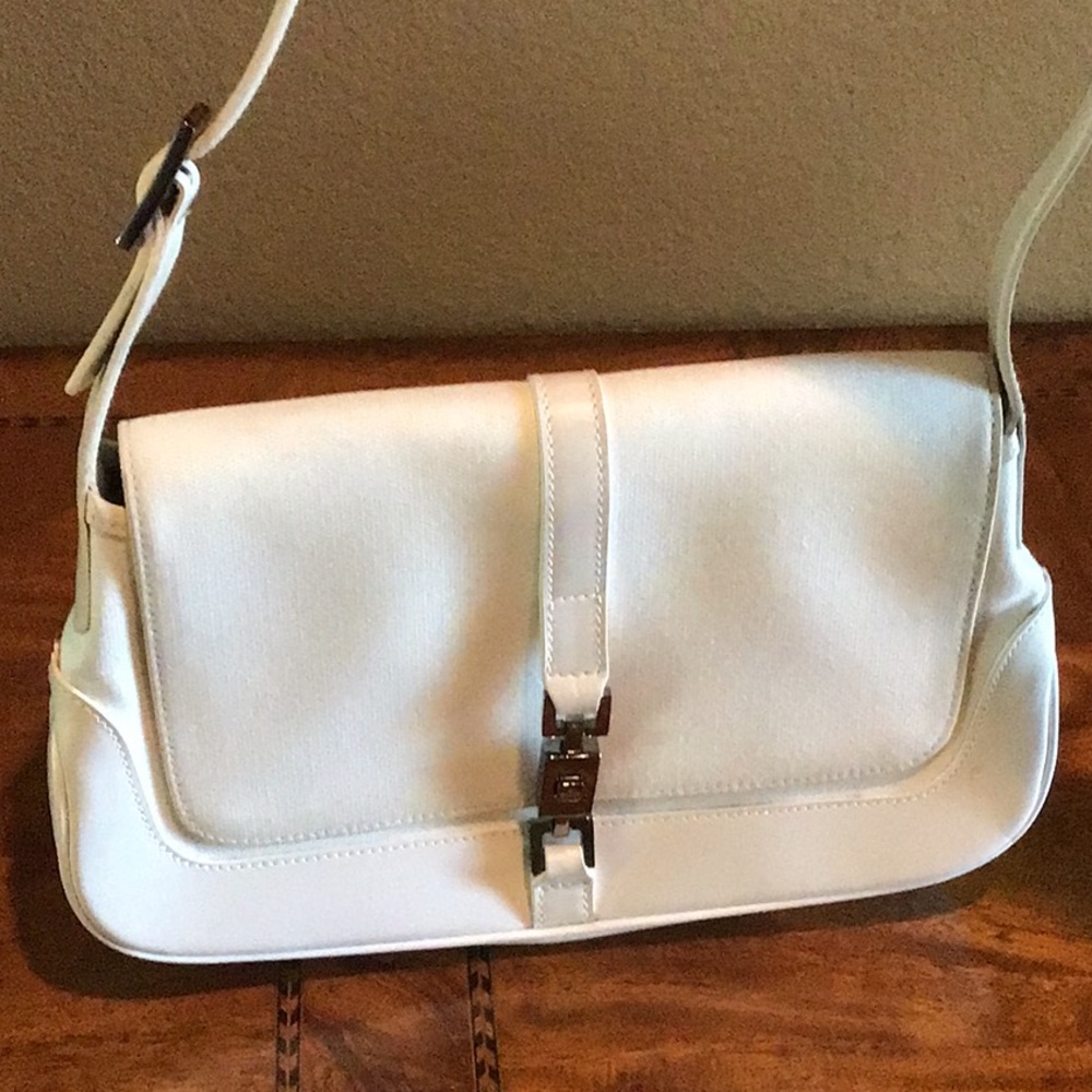 100% authentic Gucci Jackie vintage canvas and leather handbag.
